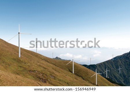 wind power farm over a hill