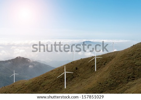 wind power farm over a hill