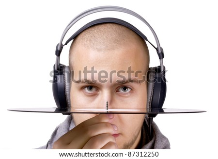 a deejay with headphones on his head holding a vinyl disk