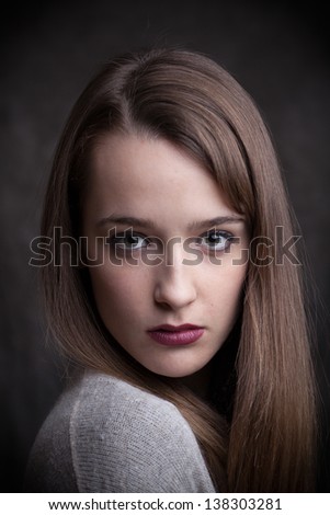 Closeup portrait of a serious lady