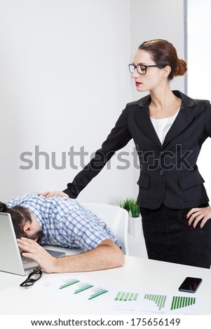 Angry female boss harassing her nerdy worker (mobbing concept)