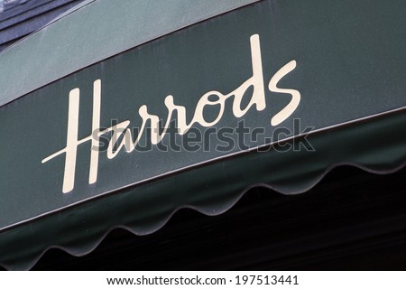 LONDON - MAY 21, 2012: Advertising canopy over the entrance of the famous Harrods department store in Knightsbridge London.