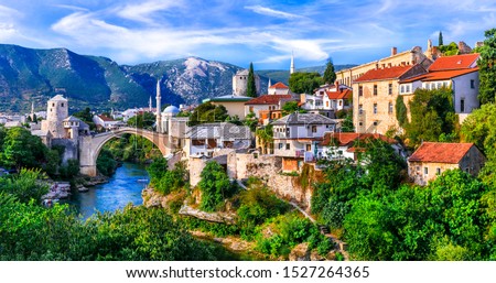 Similar – Image, Stock Photo Picturesque scenery of ancient bridge in gorge at sundown