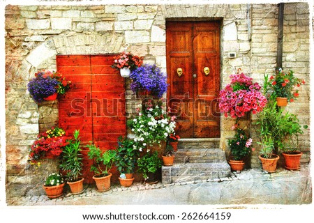 beautiful floral streets of old italian village. Spello, artisti