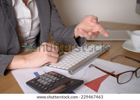 Business woman analyzing investment charts. Accounting