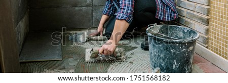 Similar – Image, Stock Photo Female mason laying a new tile floor