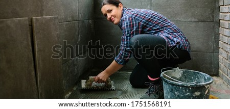 Similar – Image, Stock Photo Female mason laying a new tile floor