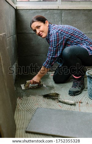 Similar – Image, Stock Photo Female mason laying a new tile floor