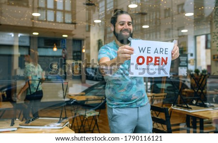 Similar – Image, Stock Photo Man placing opening poster after coronavirus