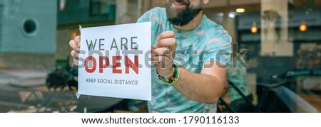 Similar – Image, Stock Photo Man placing opening poster after coronavirus