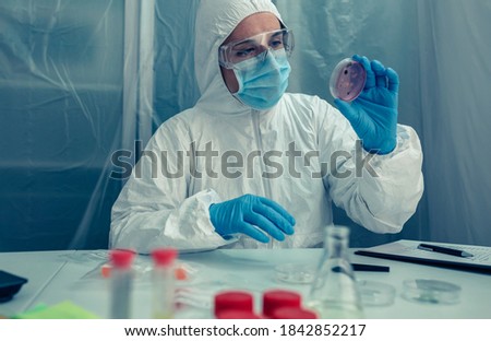 Similar – People with bacteriological protection suits looking for evidence