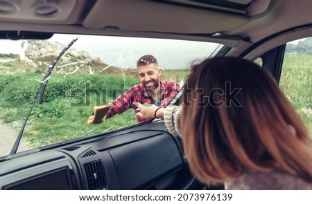 Similar – Image, Stock Photo Man cleaning motorhome glass outdoor