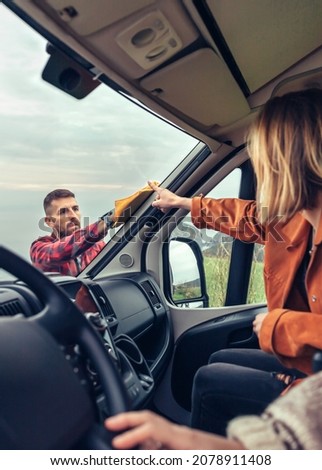 Similar – Image, Stock Photo Man cleaning motorhome glass outdoor