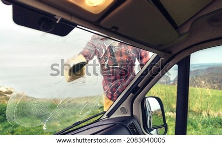 Similar – Image, Stock Photo Man cleaning motorhome glass outdoor