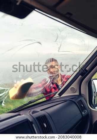 Image, Stock Photo Man cleaning motorhome glass outdoor