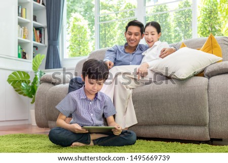 Similar – Image, Stock Photo Children playing with their toys on a wooden floor