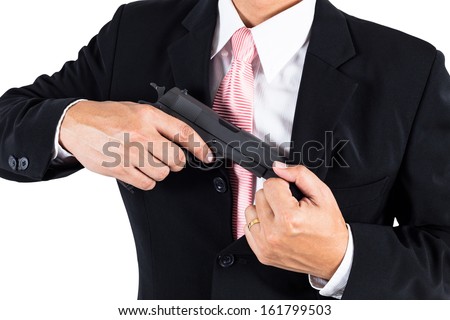 Businessman pull out gun from jacket concept for aggression