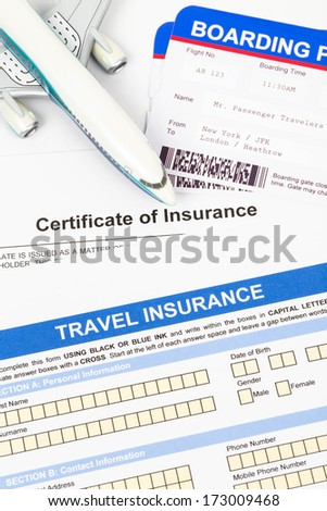 Travel insurance application form with plane model and boarding pass concept for travel planning