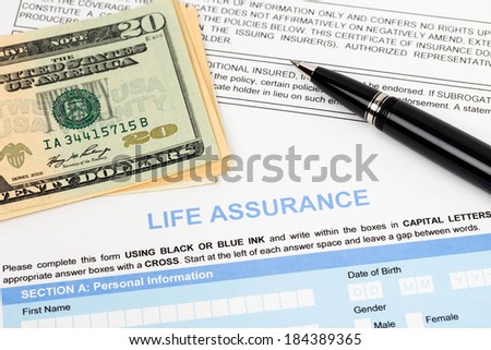Life assurance application form with banknote and pen concept for life planning