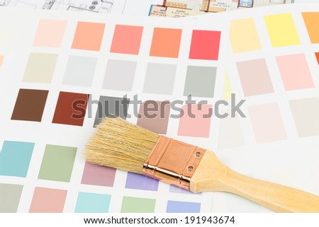 Paint color sample catalog with brush and drawing