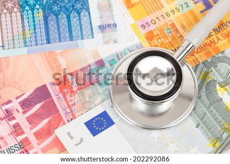 Stethoscope on Europe banknote concept financial health check