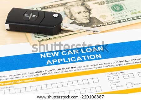 Car loan application with car key and dollar banknote