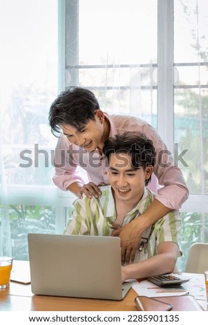 Similar – Image, Stock Photo Romantic Gay couple working together at home with their laptops.