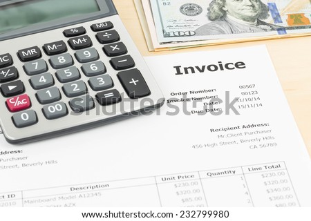 Invoice with calculator and dollar banknote