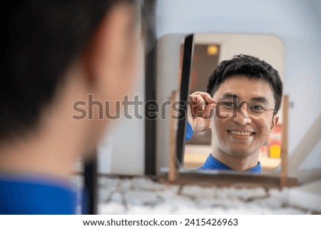 Similar – Image, Stock Photo Asian man in eyeglasses on street
