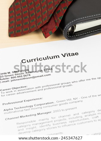 Curriculum vitae or CV with organizer and neck tie; concept job applying