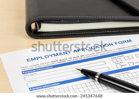 Employment application form with pen and organizer concept job applying