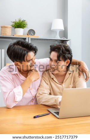 Similar – Image, Stock Photo Romantic Gay couple working together at home with their laptops.