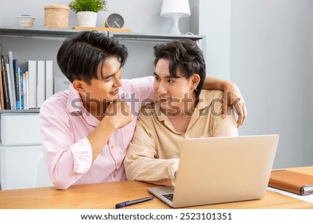 Image, Stock Photo Romantic Gay couple working together at home with their laptops.