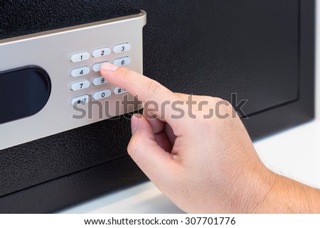 Pressing code on a safe box