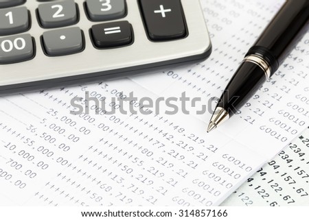 Bank account passbook with pen and calculator