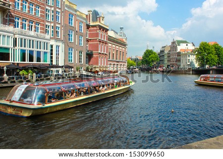 Amsterdam, Holland - 21 august: boats on Amsterdam canal on 21 august, 2012. Amsterdam has been called the \