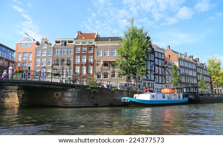 Amsterdam, Holland - 15 september 2014: boats on Amsterdam canal. Amsterdam has been called the \