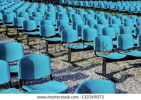 Chairs arranged in the public space for outdoor shows.