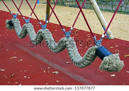 Rope toy snake  located in an amusement park for children.