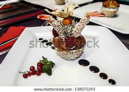 Arrangement cooking with different varieties of fish, fruit and vegetables.