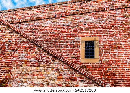 Part of old brick and stone wall, brick wall, with window, from fortress Kalemegdan, Belgrade, Serbia.