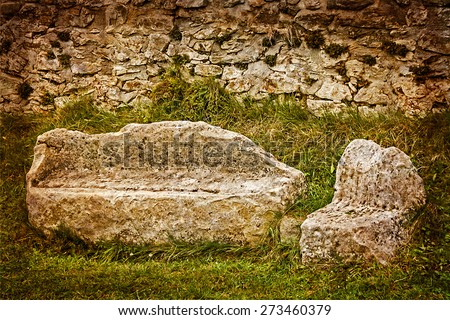 Parts made of stone bench, chair and wall, forming part of Sarmizegetusa Dacian ruins, Romania.