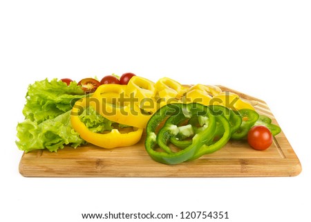 Fresh pepper slices and cherry tomatoes on white background