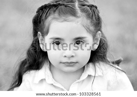 Cute little girl with big brown eyes - black and white