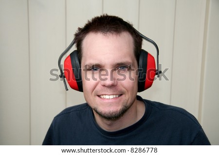 Handsome man wearing ear protection