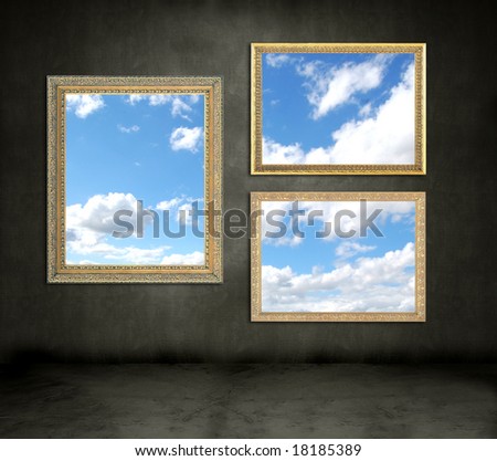 Dark grungy room with gold frames showing blue cloudy sky