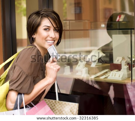 Happy woman shopping with her credit card