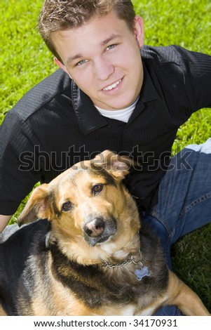 Young man and his dog - man\'s best friend