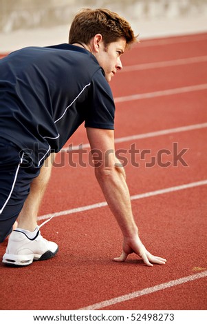 Man ready to start running a track