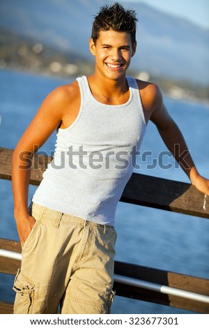 Young man standing on the pier
